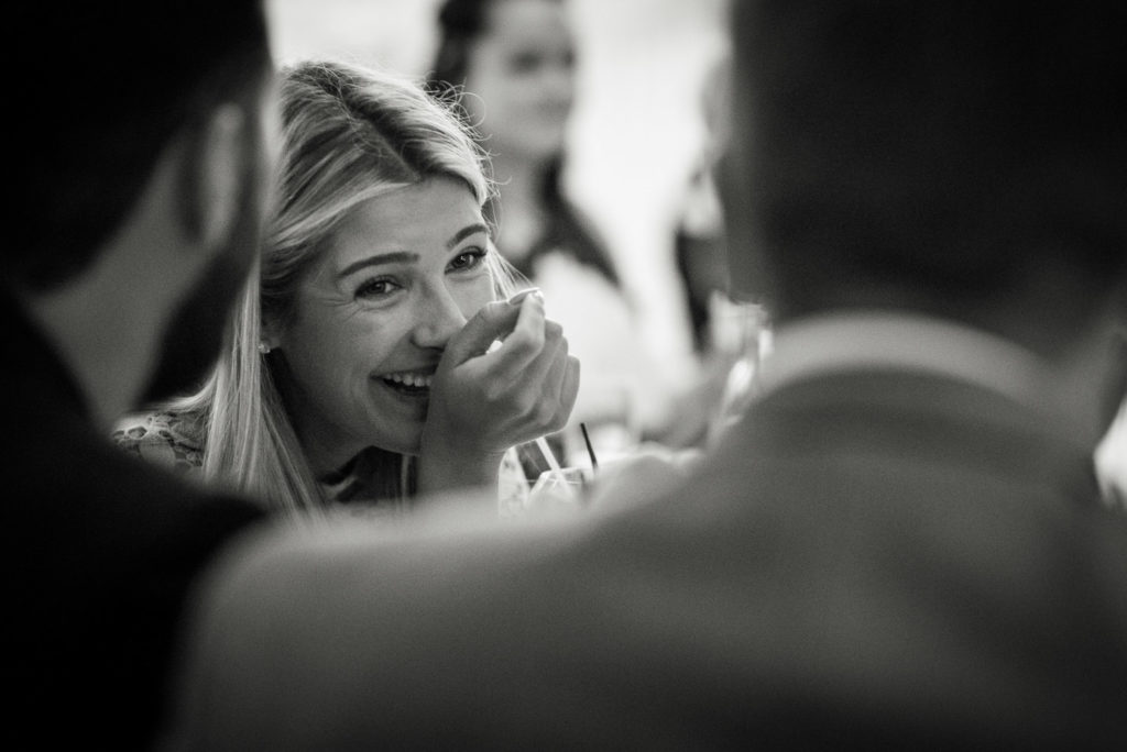 Guest laughing during wedding breakfast speeches
