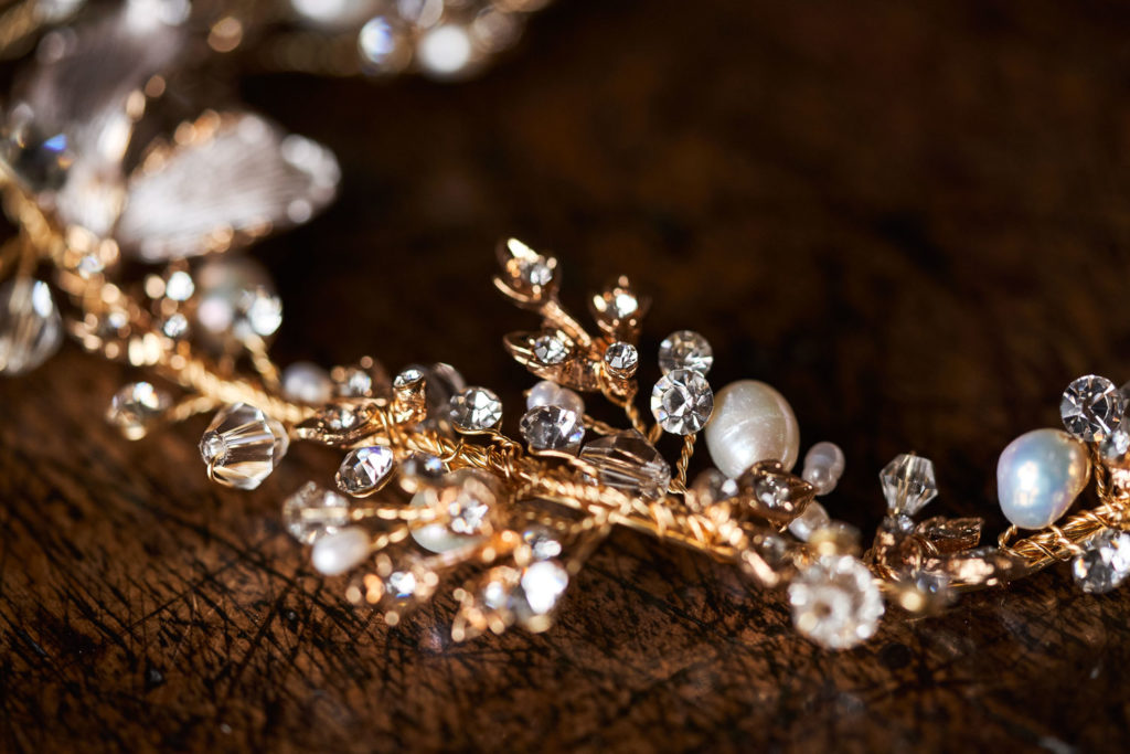 Pearls and crystals wound on gold wire hair string