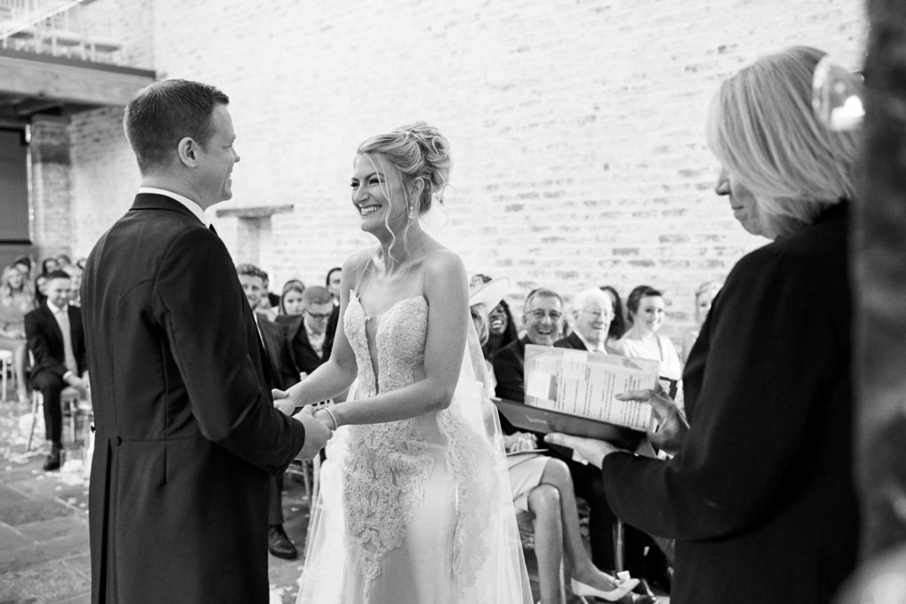 Ceremony at Dorfold Hall with bride and groom laughing with each other