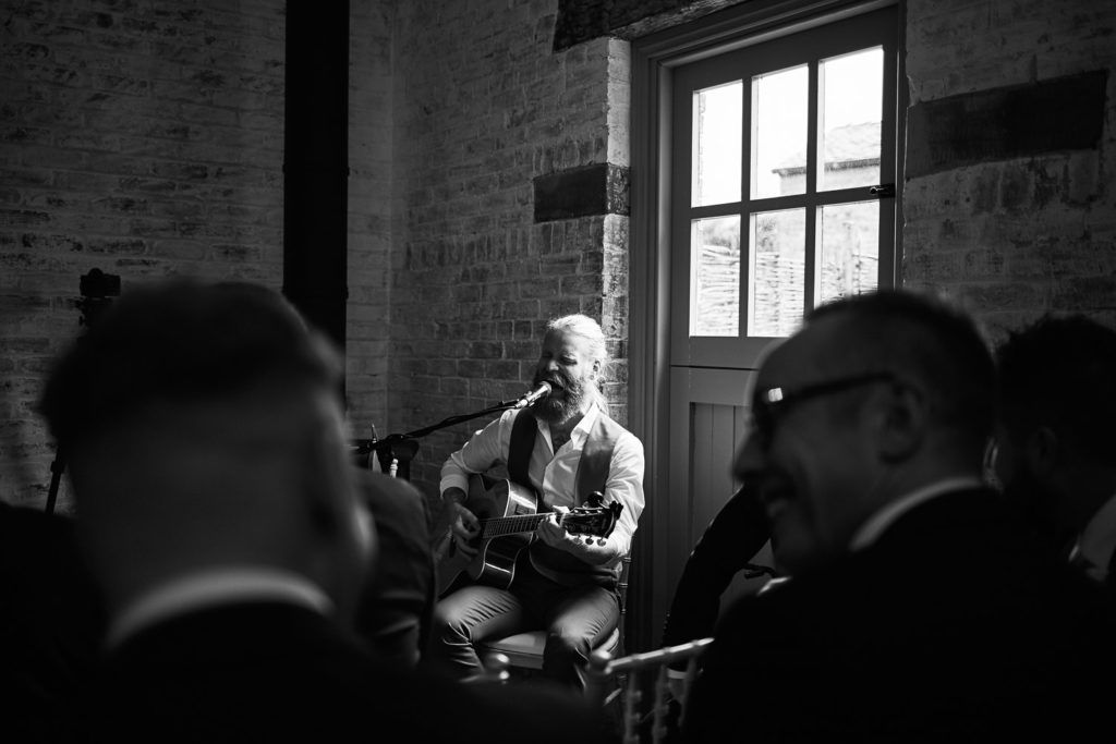 Singer Sam Ryder as he plays to guests while register is signed