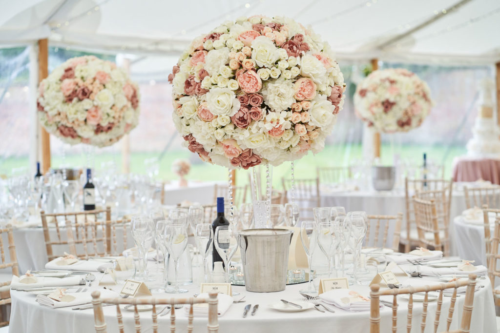 Floral table heroes of blush and dusky pinks mixed with white blooms