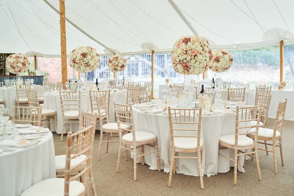 Wedding breakfast marquee at Dorfold Hall before guests arrive in shades of whites, pinks and beiges