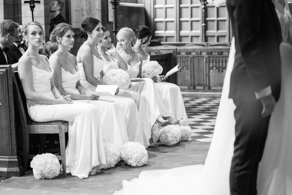 All six bridesmaids sat along the first pew during the wedding service