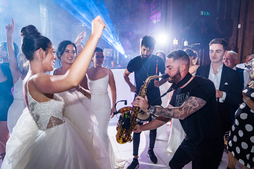Bride being performed to on the dance floor by Dax on Sax of Six15 Events